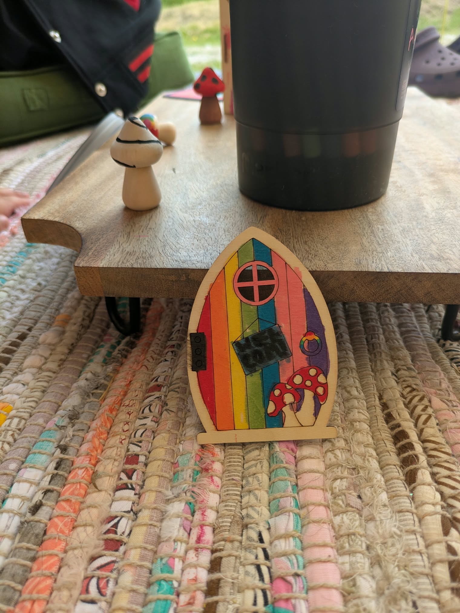 Hand-painted rainbow faerie door made in the workshop