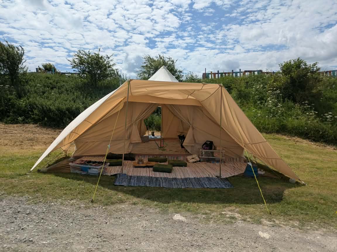 The real canvas workshop tent pitched at a festival